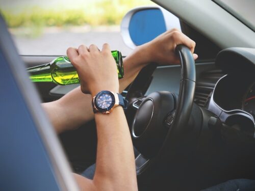 man drinking while driving
