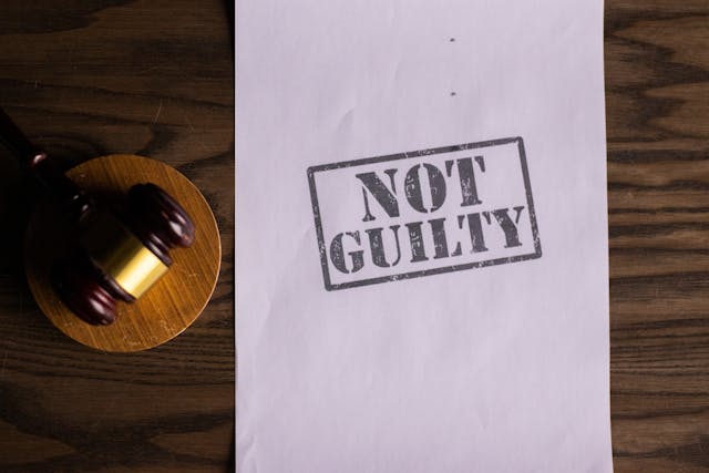not guilty paper next to gavel