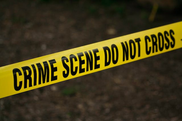 Yellow crime scene tape with the words 