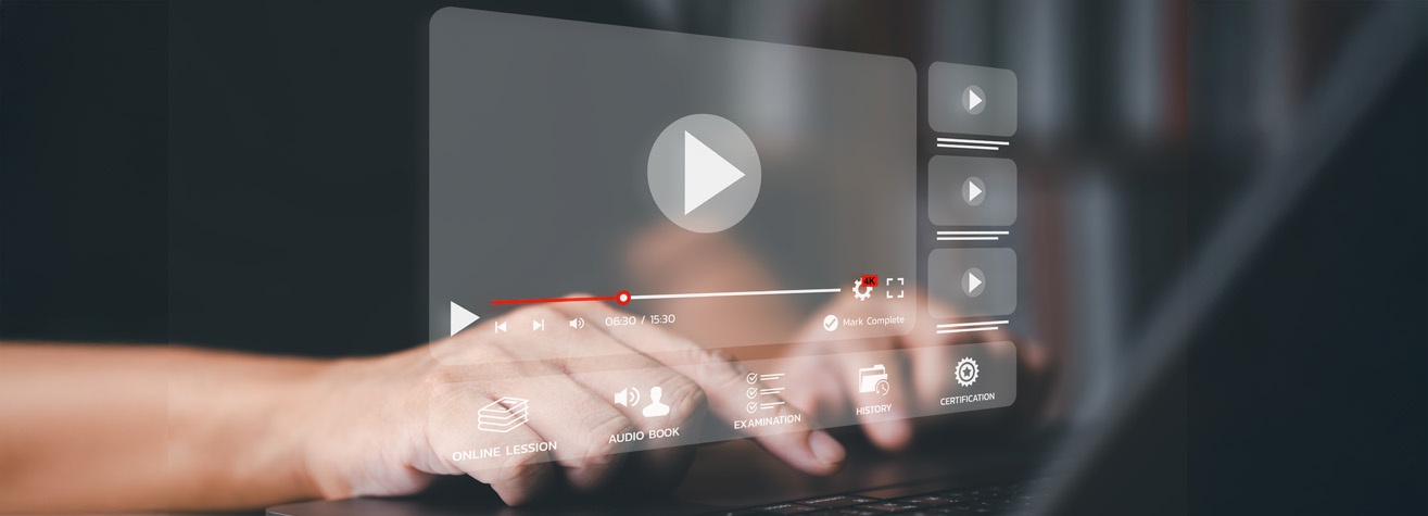 Close-up of a person interacting with a virtual video player interface on a touchscreen or holographic display. The screen shows play, pause, and menu buttons, with options like online lesson, audio book, examination, lesson, and certification.