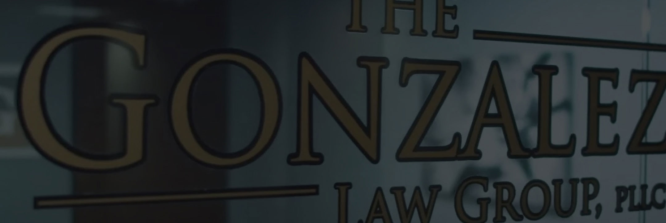 The image shows a glass door or window with the words 